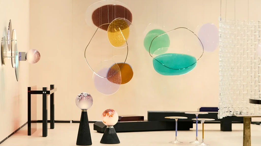Suspended glass-disc installation in pastel tones — Salone del Mobile 2026