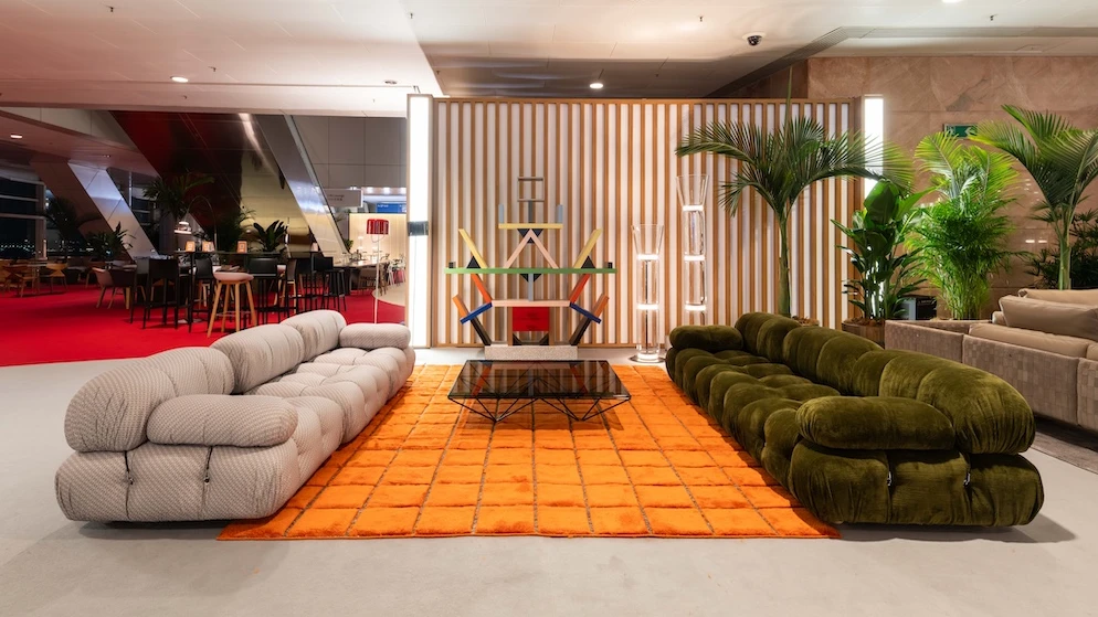 Cassina Camaleonda modular sofas on an orange rug — return of comfort at Salone del Mobile 2026